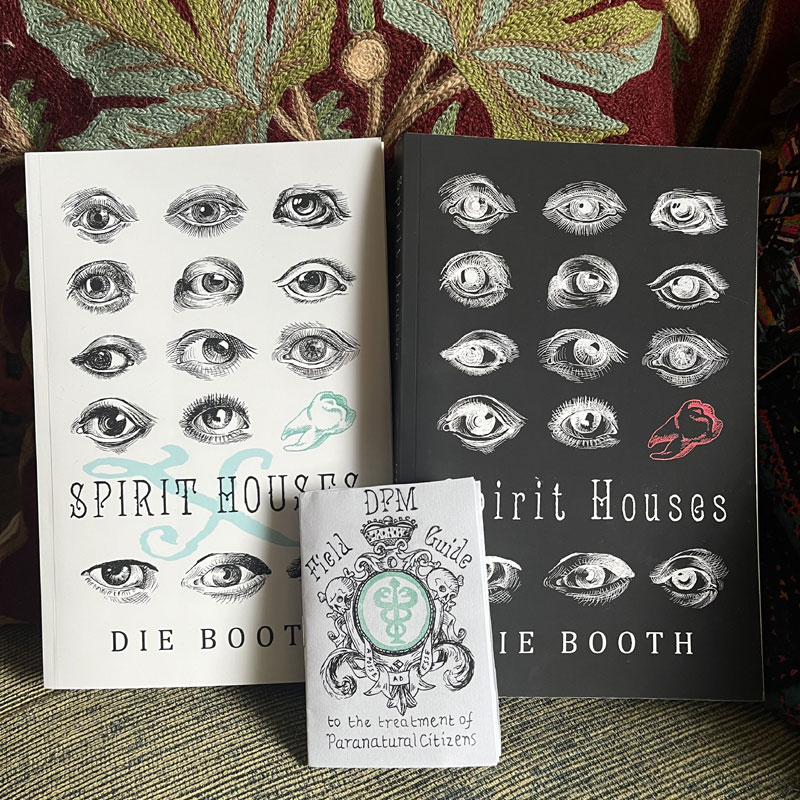Copies of Spirit Houses - both normal version (black cover with white eyes) and anniversary X variant (white cover with black eyes) and limited edition companion zine 'DPM Field Guide to the treatment of Paranatural Citizens'